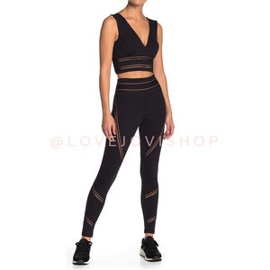 FREE PEOPLE Ascend Black Leggings | Sculpted Cut-Outs Design in Black & Orange